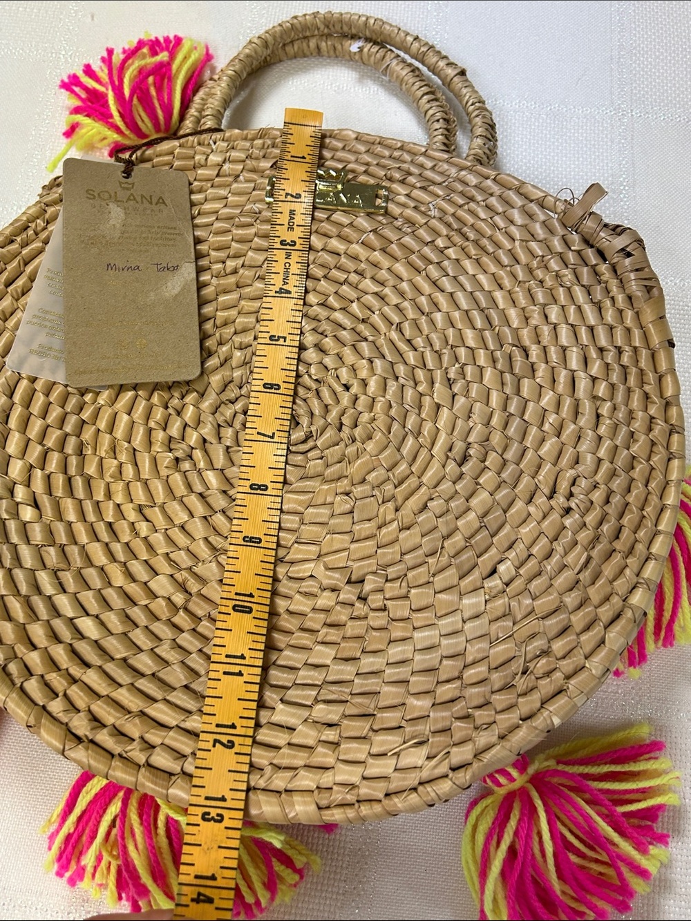 Solana Round woven Straw Tote with Hot Pink & Neon Yellow Tassel Detail image 6